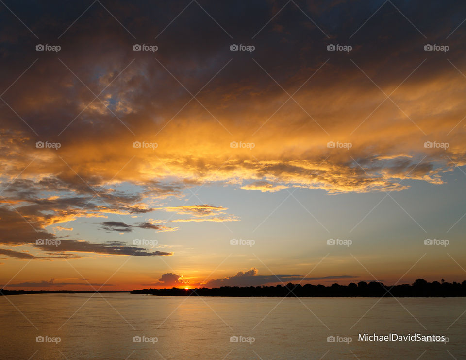 Sunset Sol Sun pôr do sol sky céu nuvens light background stock beautiful michaeldavidsantos
