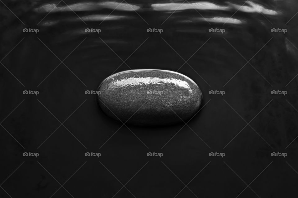 Stone in water.