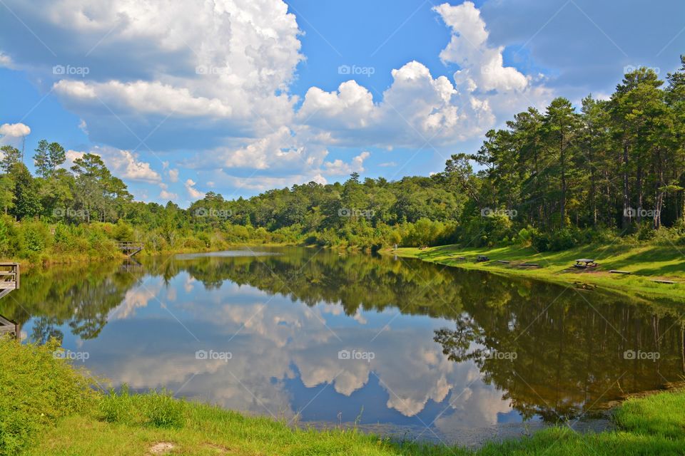 
Reflections show the world around us. They can reveal aspects of a scene we might otherwise miss. They are — or can be — great additions to any sky. Water is one of the easiest reflecting surfaces to capture beautiful clouds after sunset