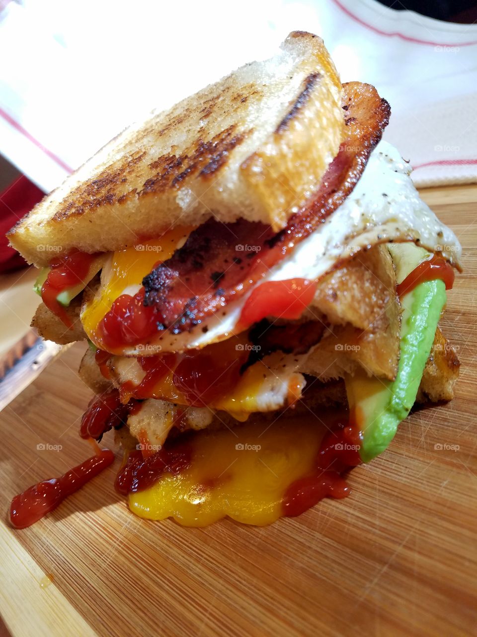 egg bacon avocado ketchup sandwich