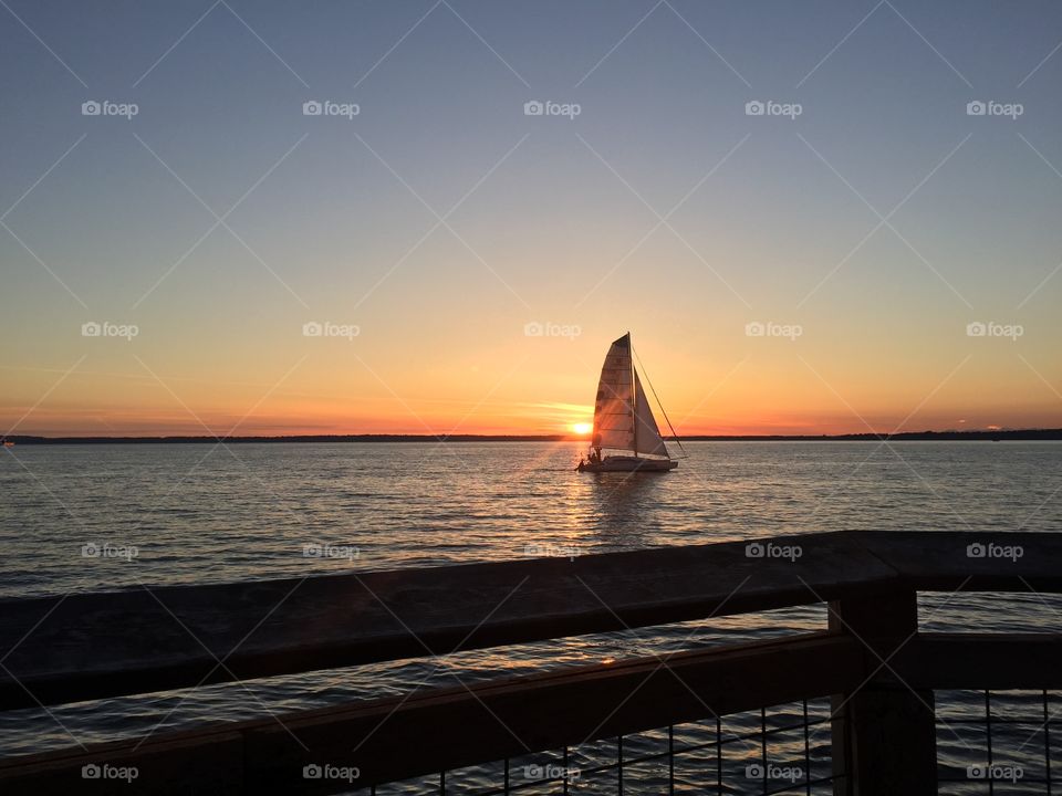 Sailboat Sunset. Watching the sunset at sailboats float by