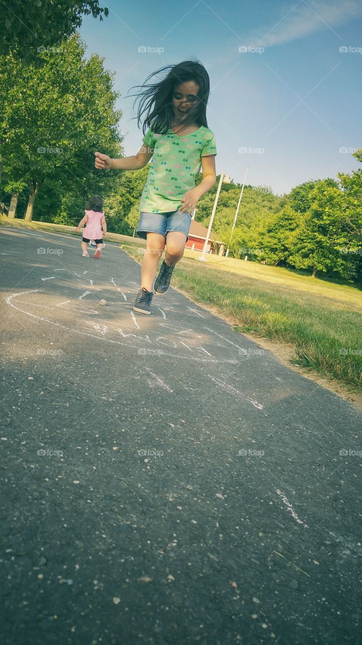 Child girl playing on road