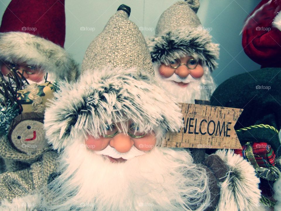 Father Christmas decorations holding a welcome sign
