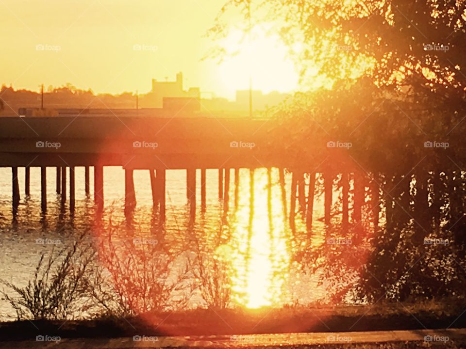 Sunset over the river bridge.