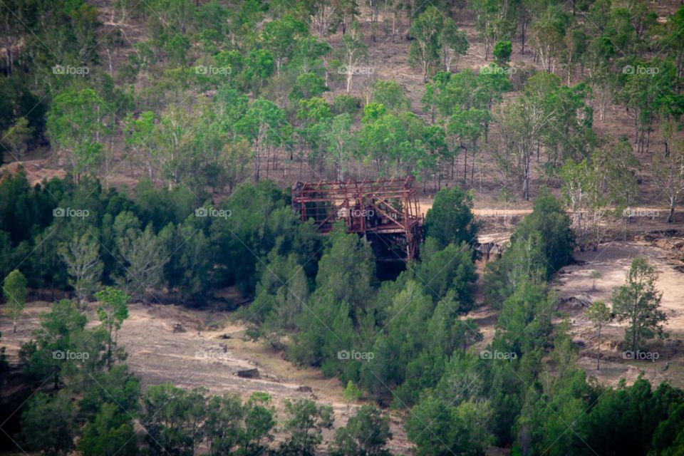 Aerial view of abandoned dredge in dry river bed in outback Queensland Australia 