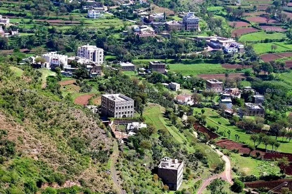 A stunning view of green mountains covered in fog in Yemen