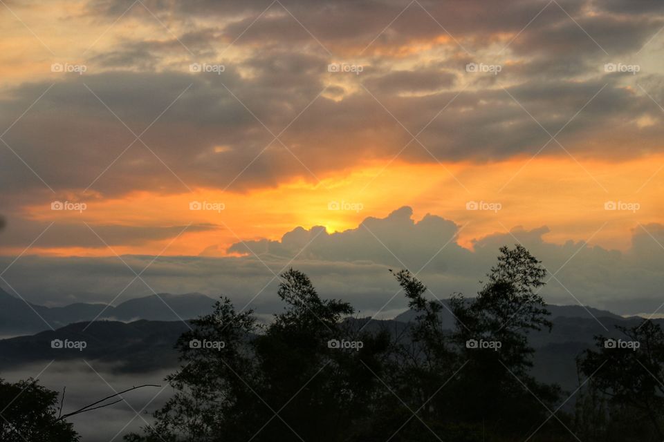 Sunrise kisses the sky.