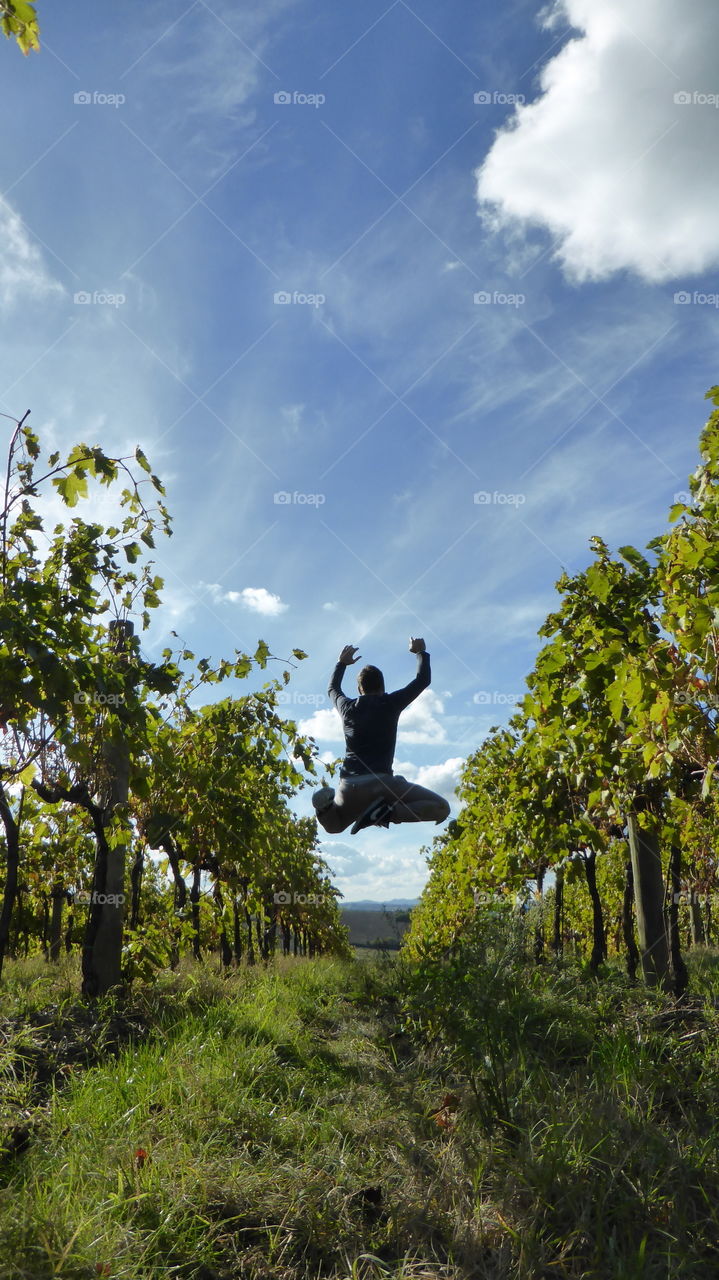 A man jump between the colors of the nature