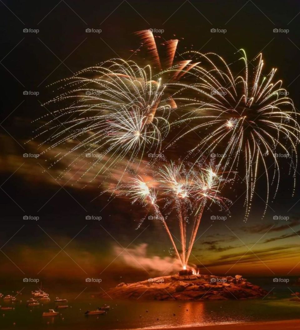 Fireworks from a little island on Bastille Day in Tregastel