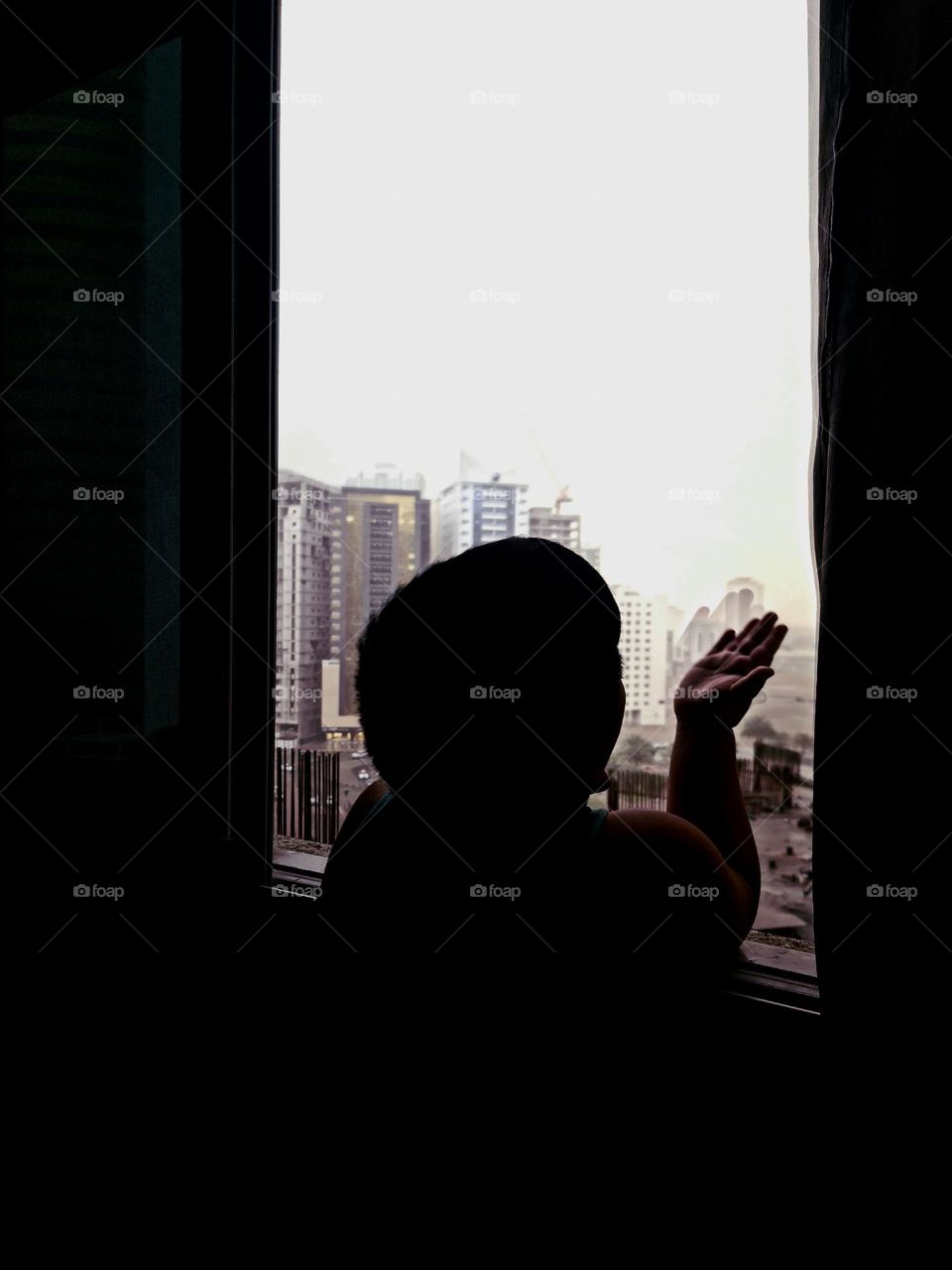 No money can buy the happiness of Ma boy enjoying  the rain in window... God's gift...