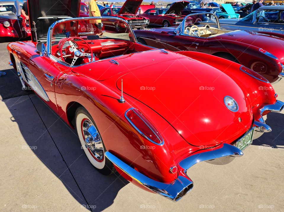 A 62 Chevy Corvette is a beautiful sight as it sits and receives admiration from the crowd