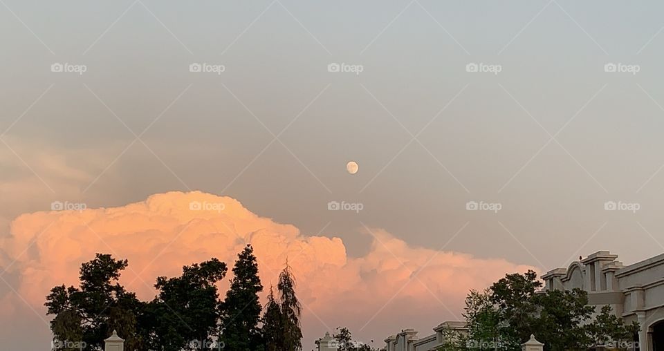 Fluffy clouds and moon 
