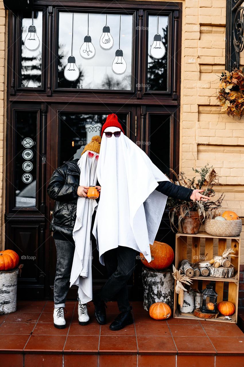 Teenagers in ghost costumes. Halloween party