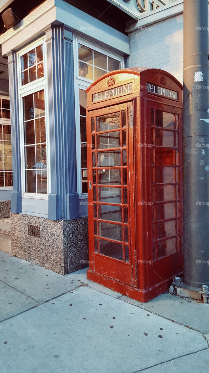 Old fashioned phone booth. quirky red phone booth