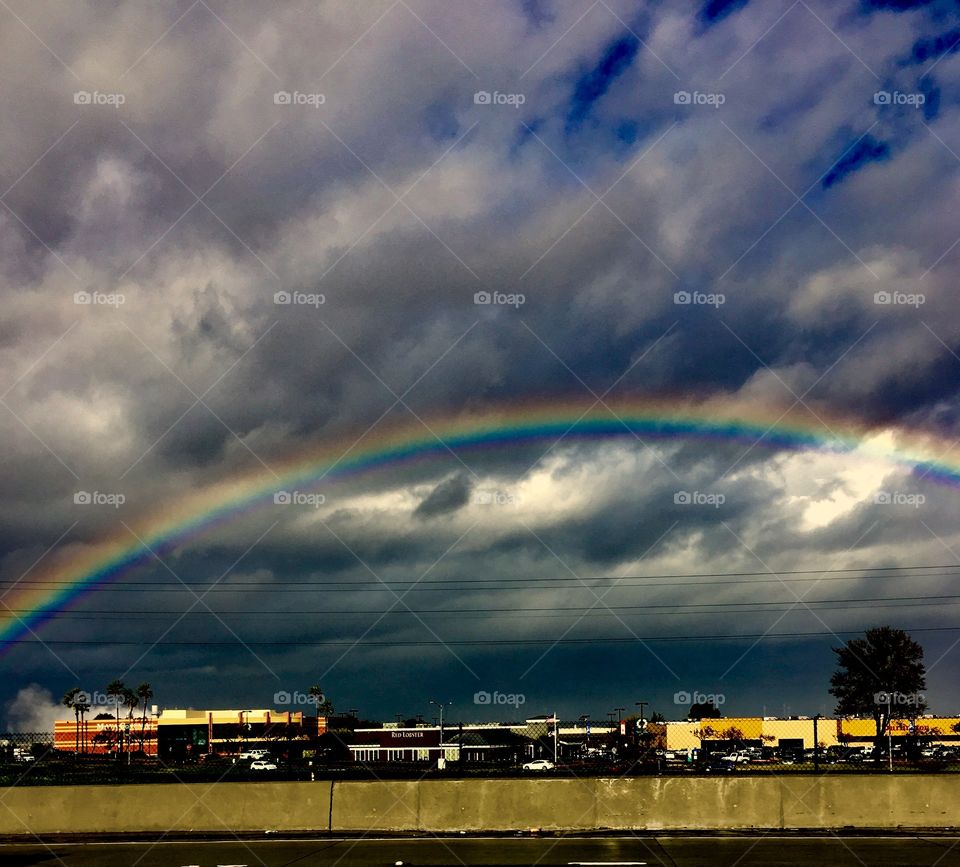 Storm clouds and bright rainbow over Antioch, CA 