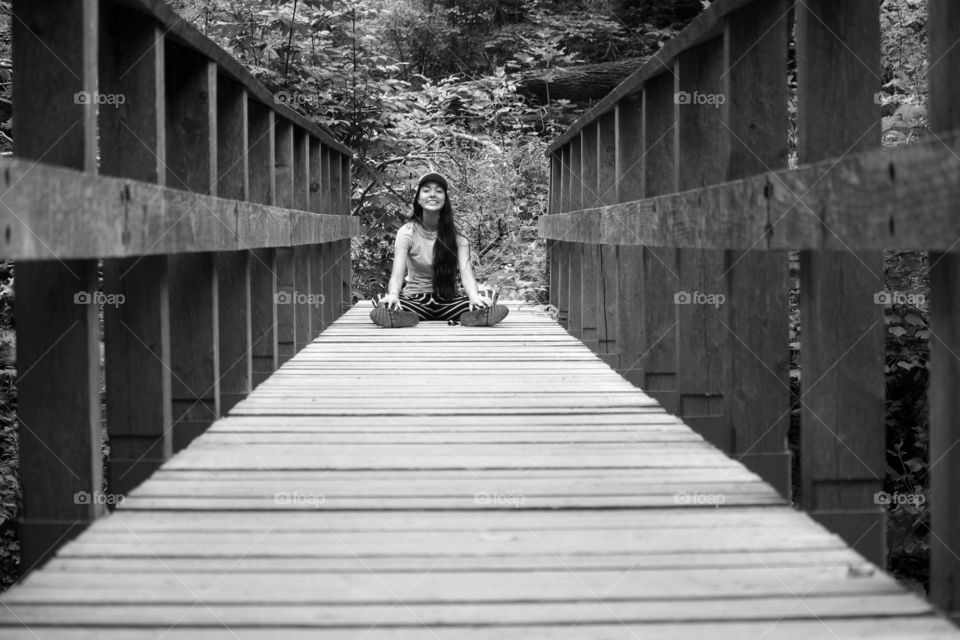 Teen on a bridge