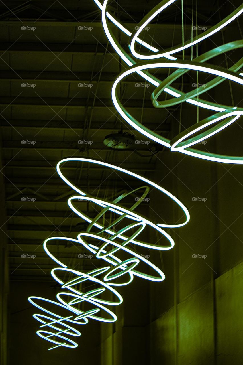 Multiple yellow green LED ceiling lights as a room lighting and ambiance making a great and stylish hallway design.