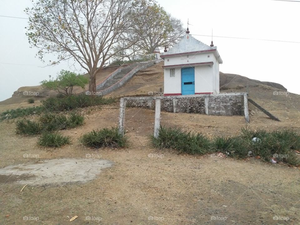 A beautiful scene of Lord shiva's temple in the hill