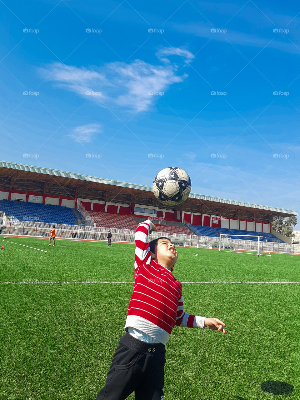 kids in stadium playing soccer