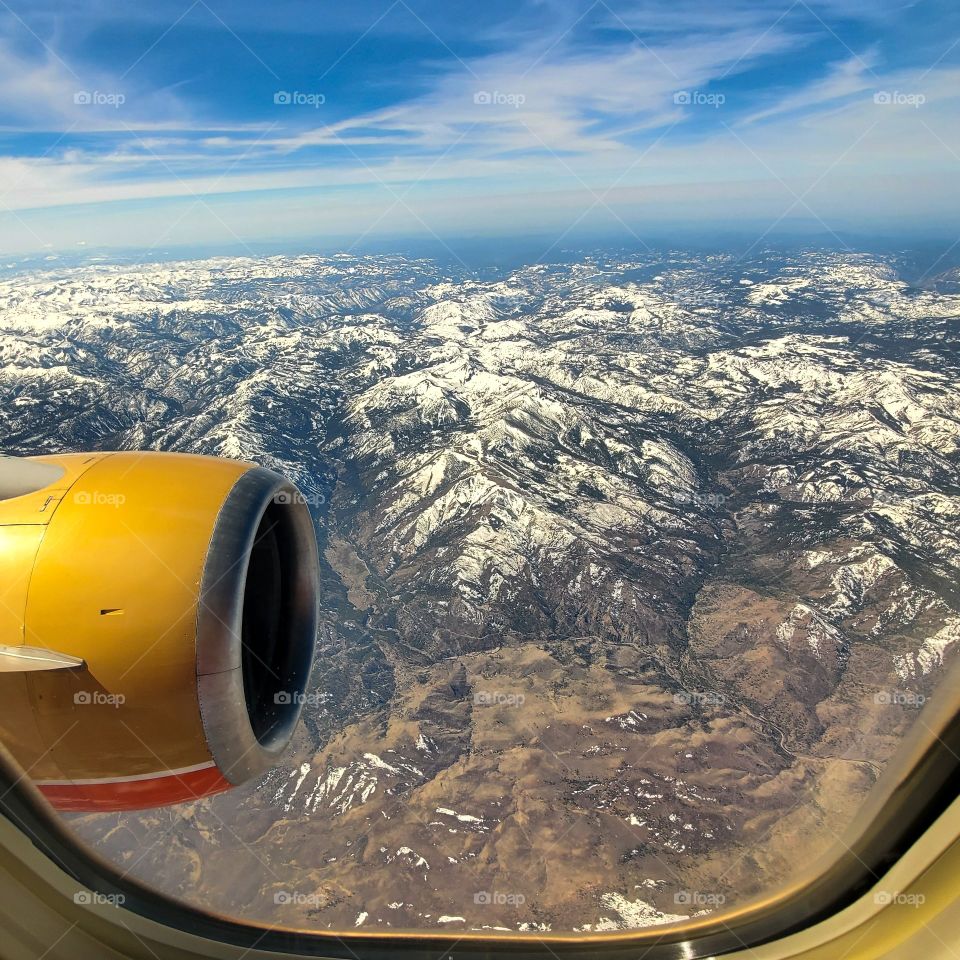 The Sierra Nevada mountain range still has snow capped peaks despite being Spring