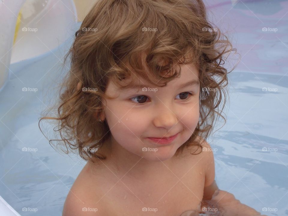 Baby girl in the swimming pool