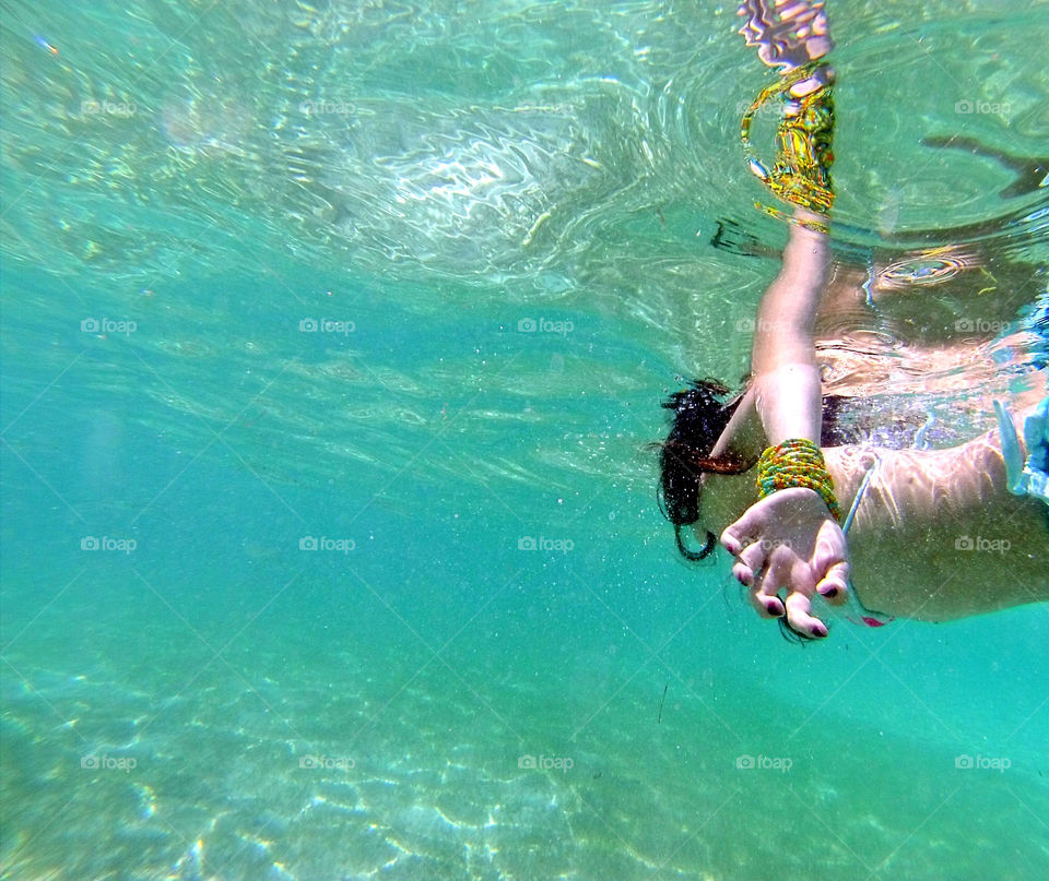 Swimming underwaters at the beach in Paradise