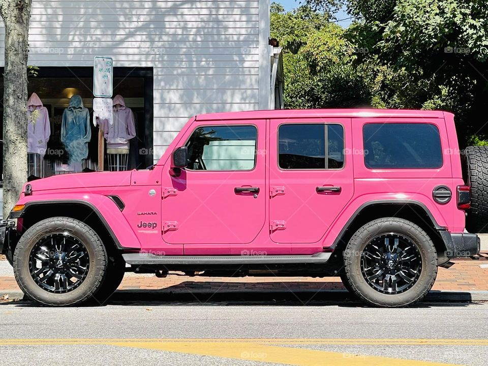 Pink SUV-pretty while driving. Bright pink off the road SUV. 