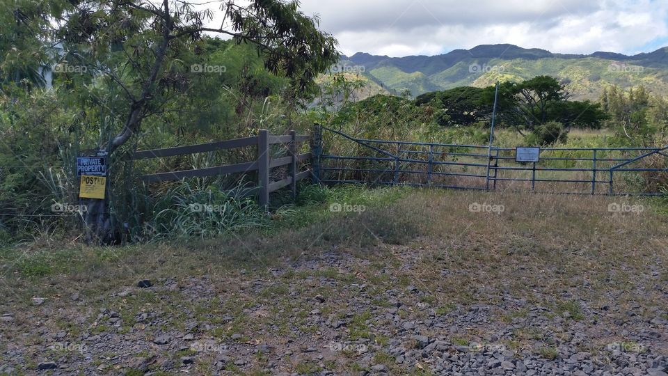 Private Property. Fences block access to fields and mountains in Hawaii.