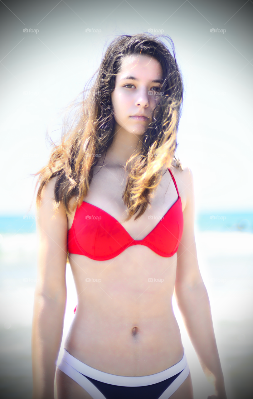 Teenage girl standing in bikini