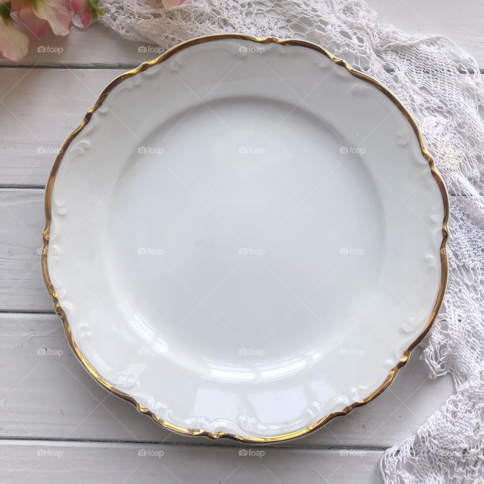 Cream porcelain plate with relief and golding