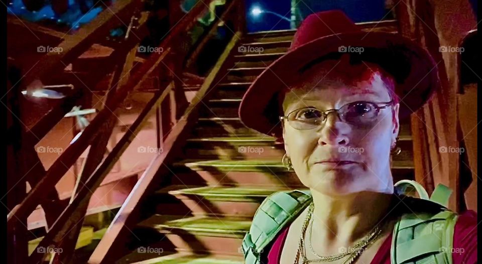 I am walking up the red metal staircase of the “Pulaski Bridge” at “Newtown Creek” on the “Greenpoint”, Brooklyn side carrying the few items I bought in “Bushwick”. while I was there to fill my prescriptions. 2023. Hypnotic Productions