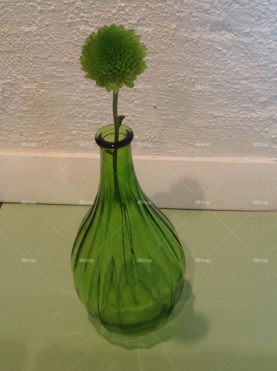 A green glass vase.