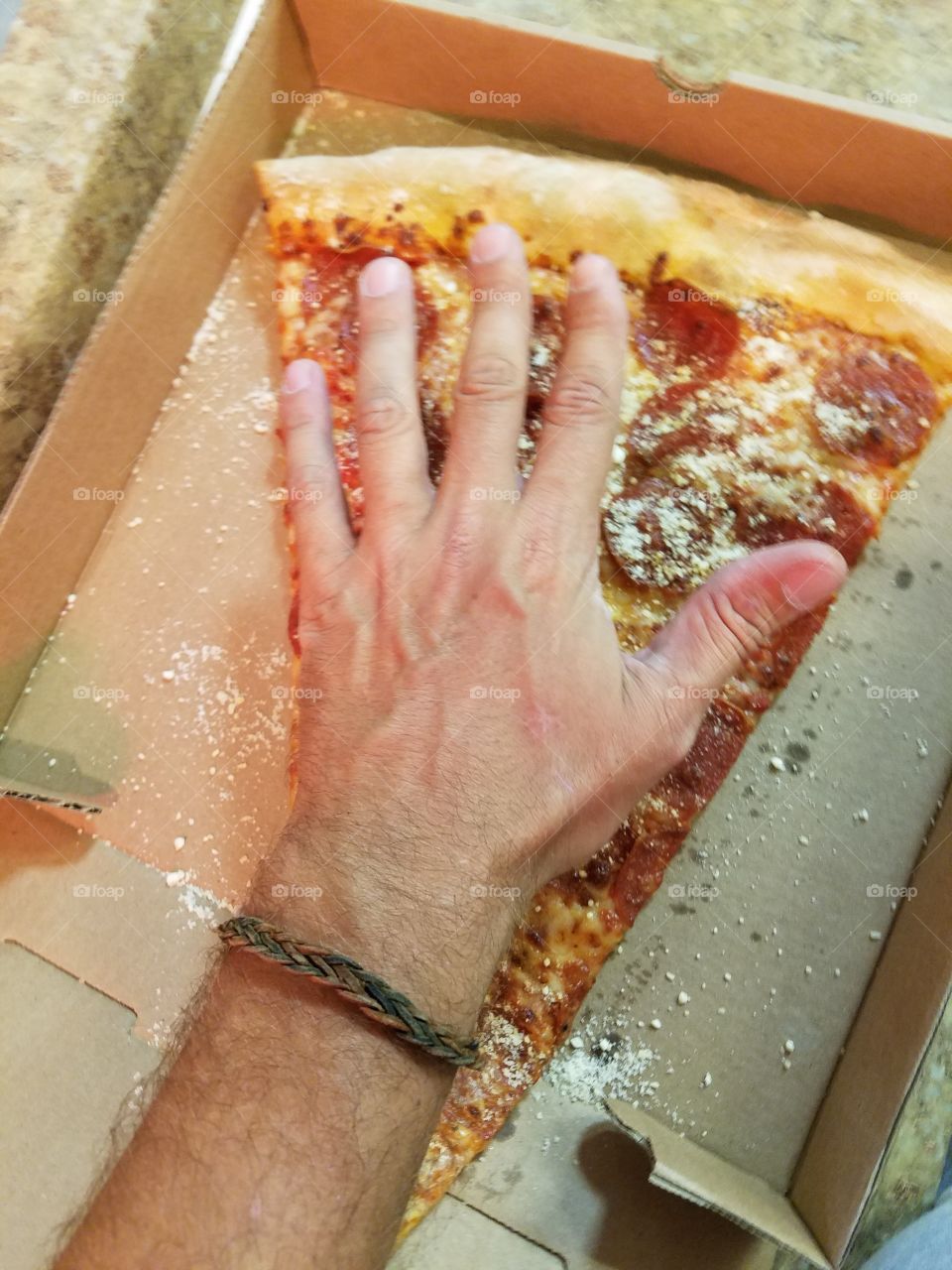 Washington dc jumbo slice of pizza, bigger than my man hands