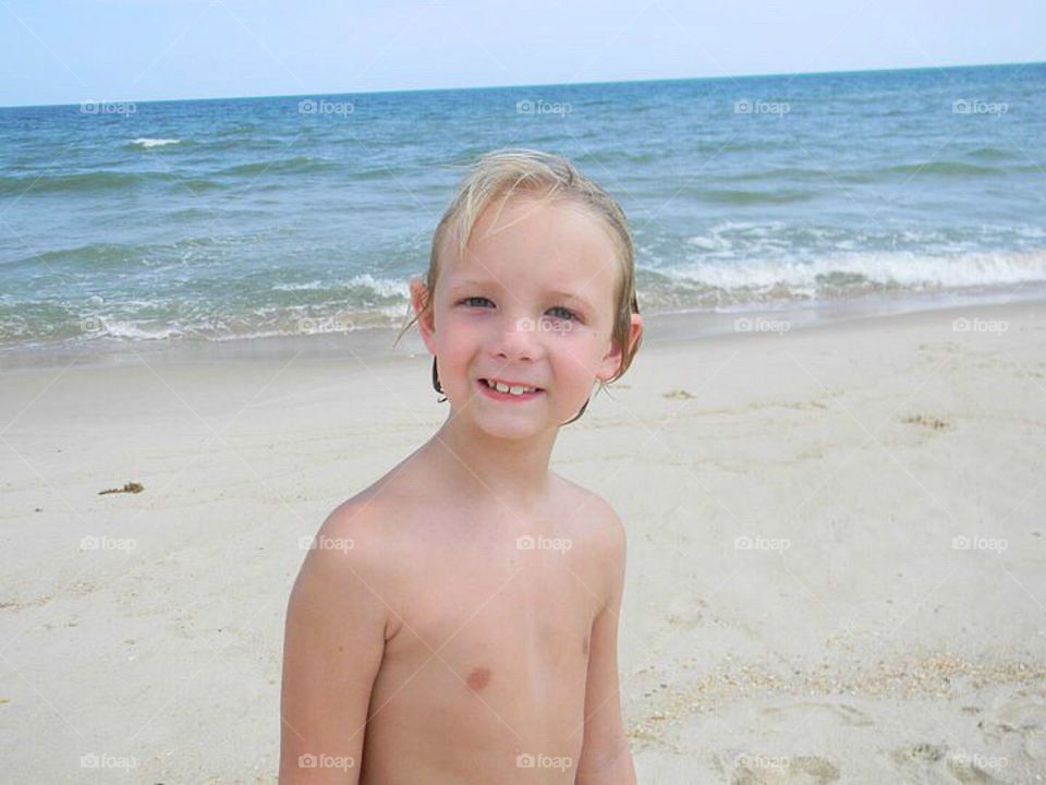 Portrait of a smiling boy at beach