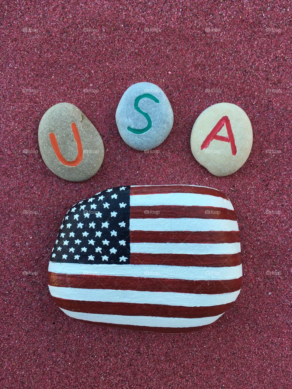 USA with Stars and Stripes on stones 