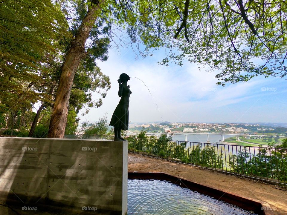 Statue in a public garden with view