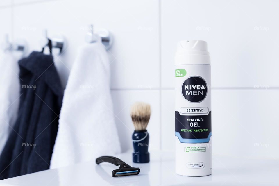 Nivea men sensitive shaving gel with razor and brush in the bathroom 