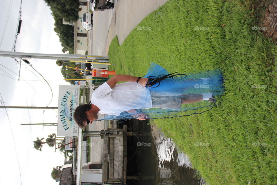 Fisherman with cast net