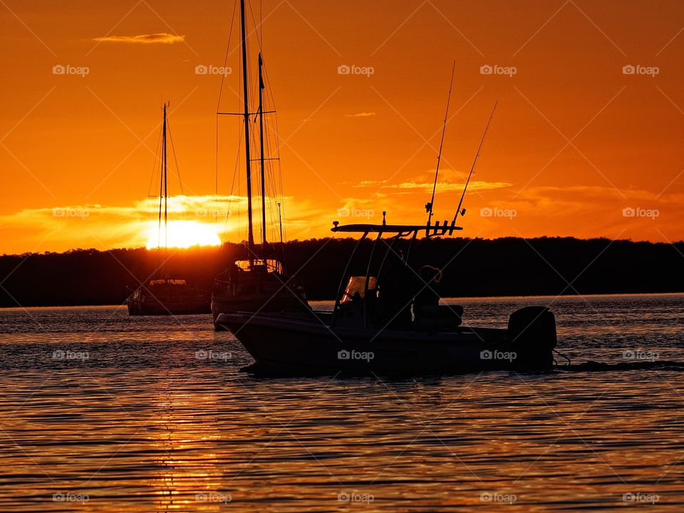 Silhouette of boat during sunset