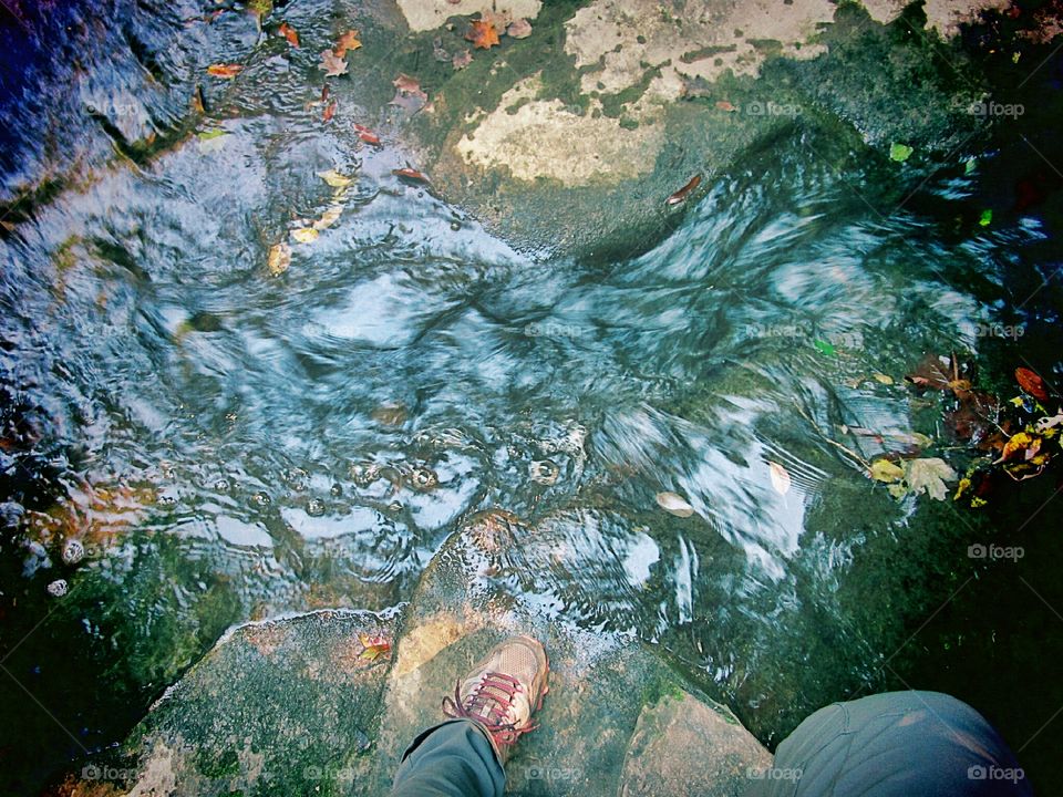 crossing a stream on stones