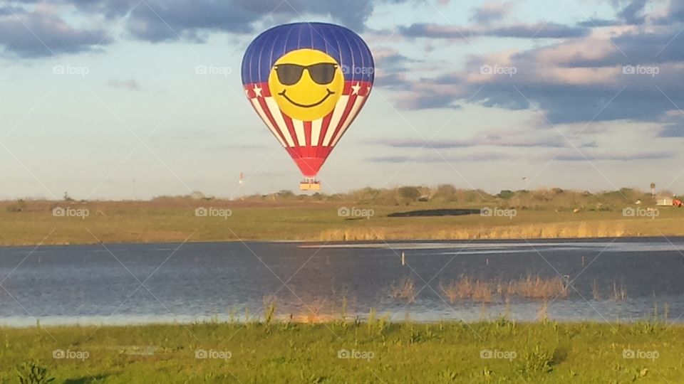 hot-air baloon. took our dog on a walk to the lake by our house and saw this.