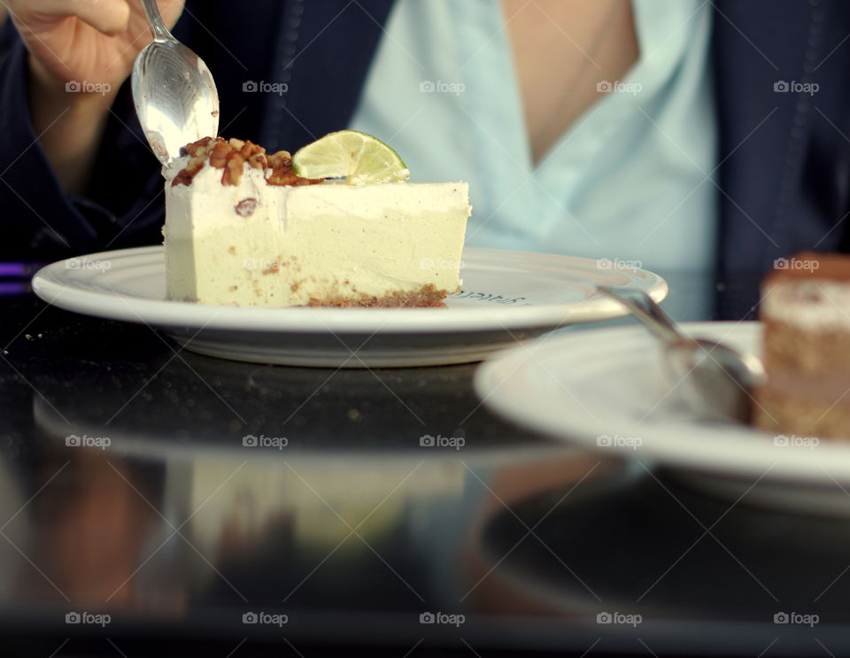 A person eating vegan key lime cake