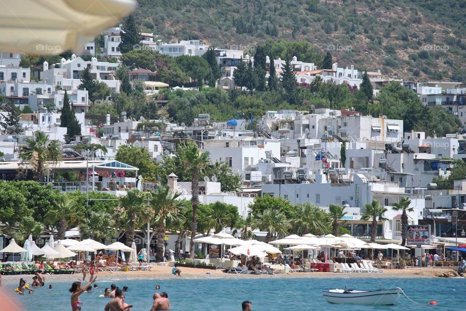 Beach and white houses in Bodrum in Turkey