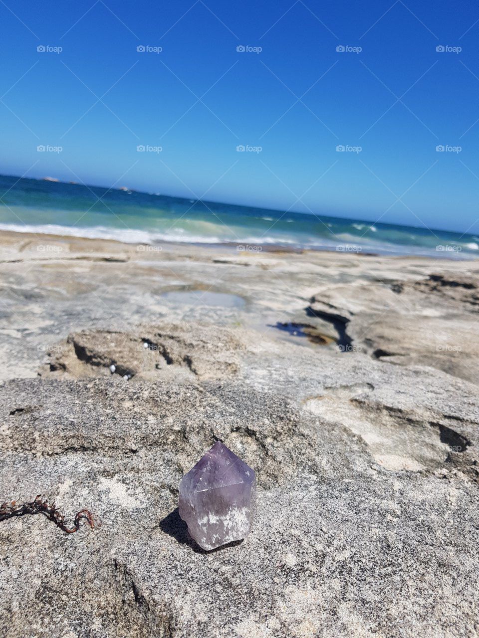 Crystal on rocky beach