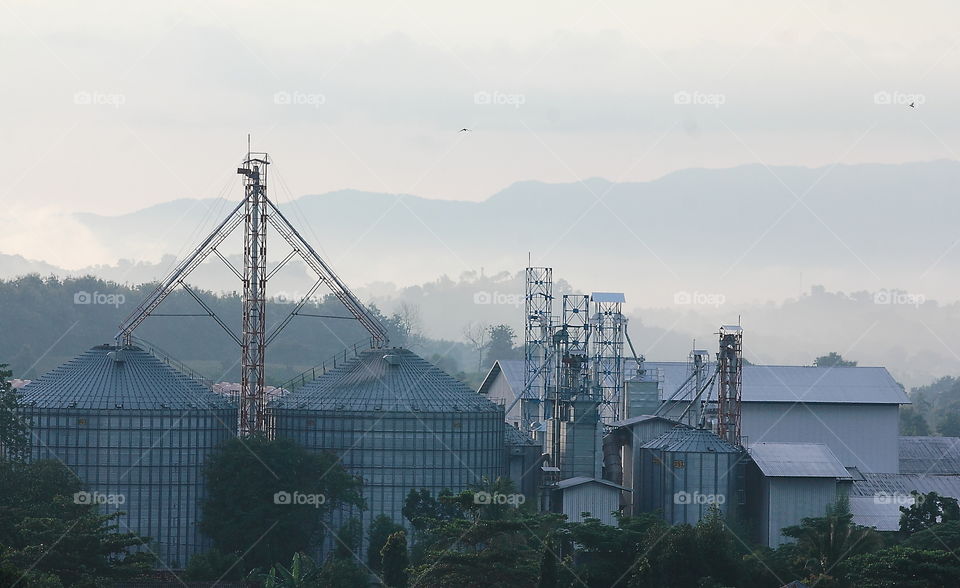 Morning factory viewed from the road way . Here's true road way for the name of Jalan Bay pass to connect two large district of province , SumbawaBarat , and Sumbawa . More than looking for temple where the beauty landscape ready for baground, beauty