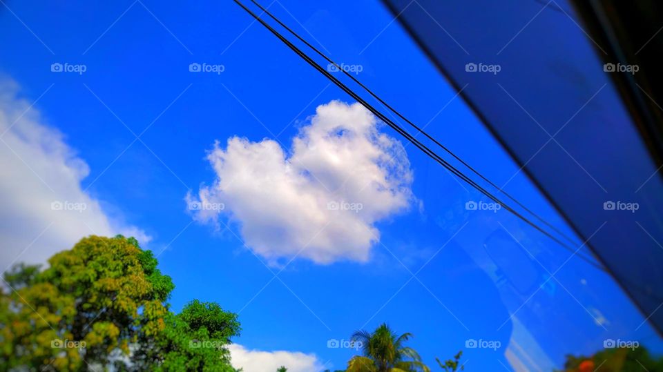 Heart shaped cloud in the beautiful blue sky