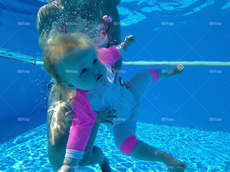 Underwater baby. Our daughter Chloë getting dunked by her Mum.  Skopelos hotel pool. Alkistis 