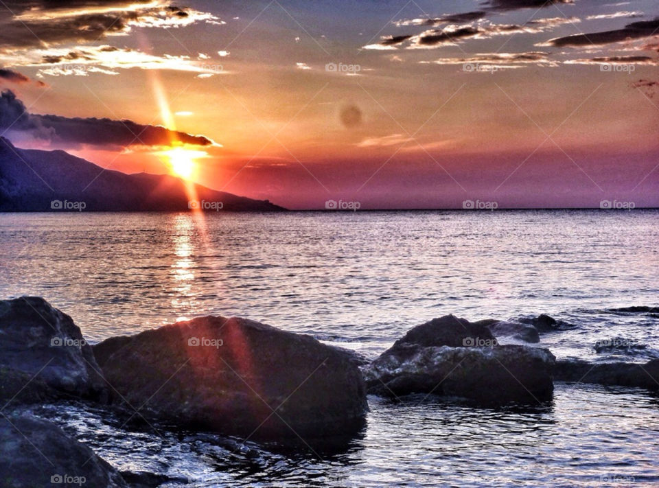 beach clouds sun water by yeadon