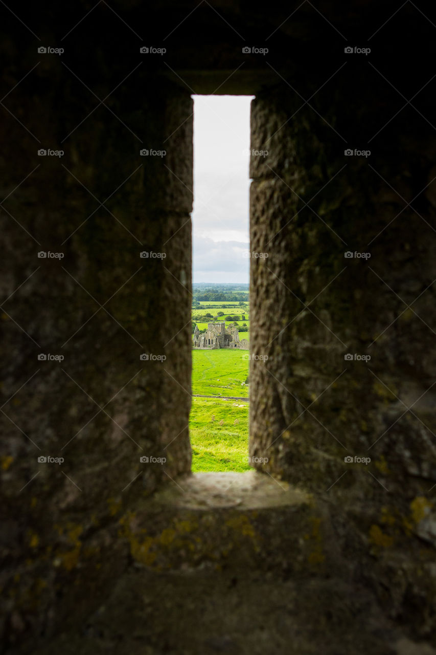 Framing the subject for this composition. Ancient castle image through a window in the wall.