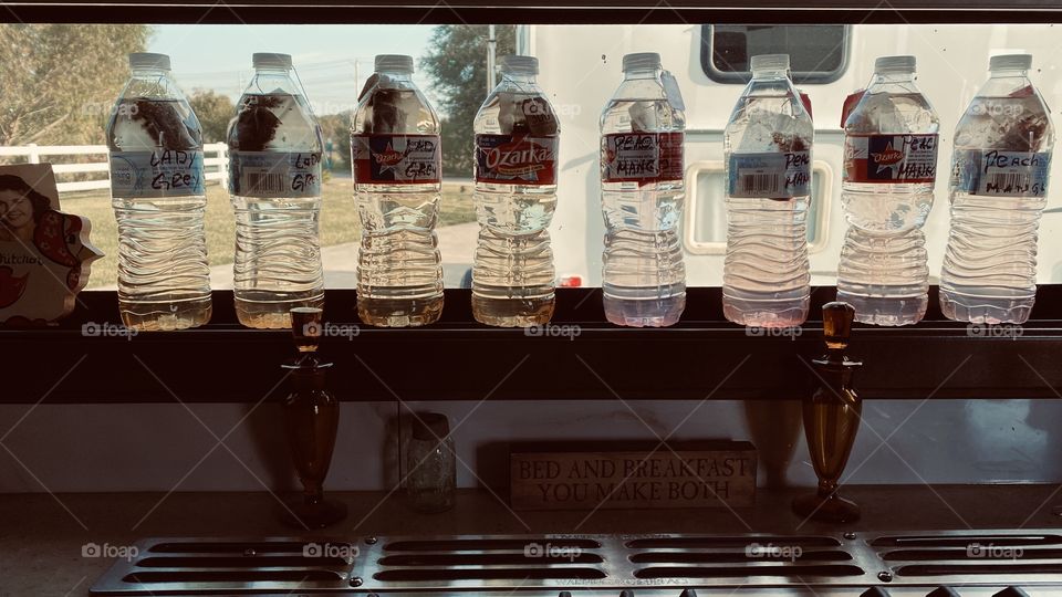 Nothing like a fresh bottle of sun tea with lunch. I use purified bottle water. Hang tea bags  inside with the string as far as inside the neck and cap tight. 3 to 4 hrs of direct or indirect sun and Wohla. Fresh tea pull tea bags out and keep frig. 